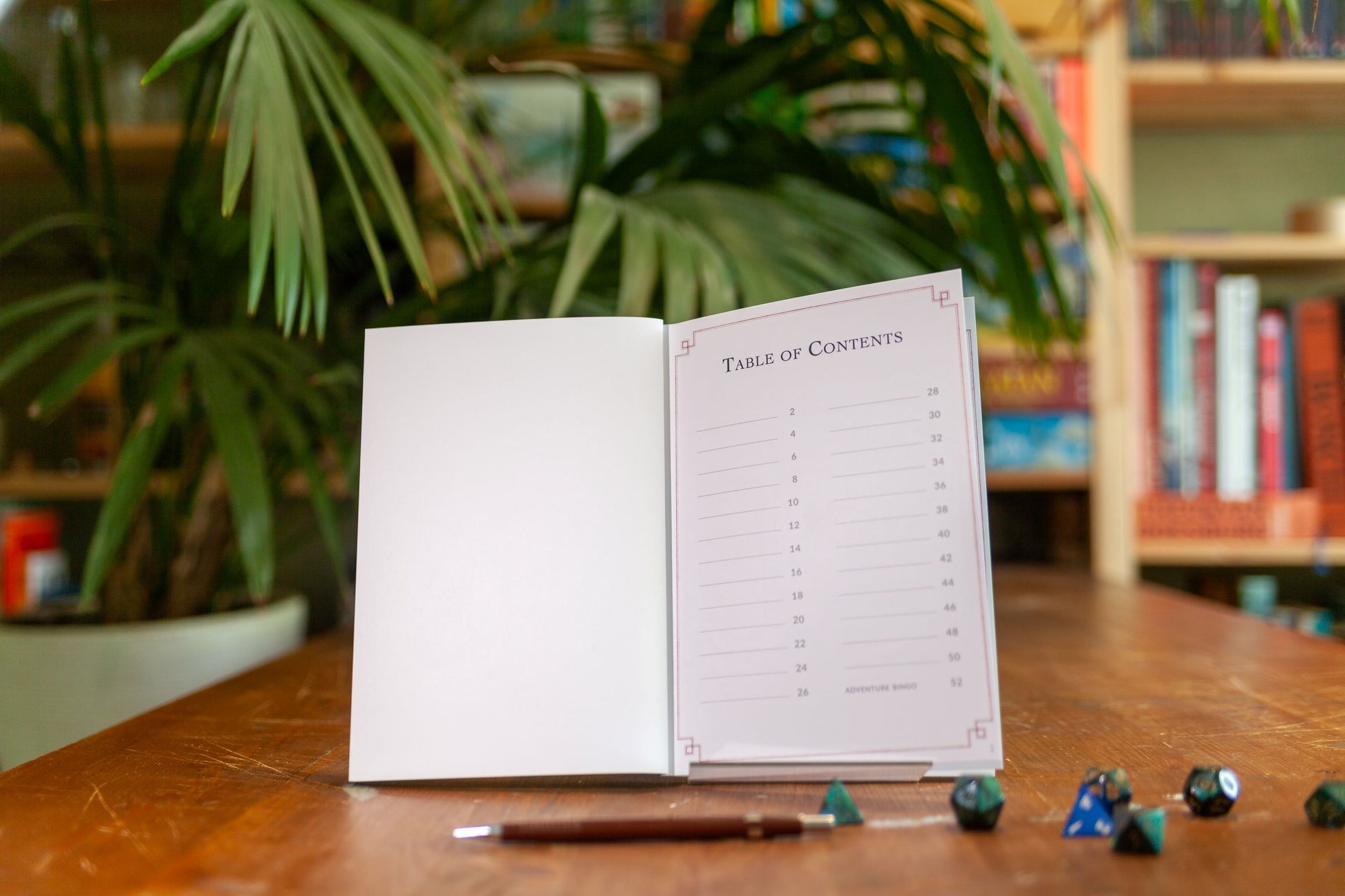 The first page of the Adventure Log is a blank table of contents. The player can write down the names of sessions, the date, or the name of the character that was played that session. It's up to them! At the bottom you can see that on the last page of this DnD notebook is an adventure bingo.