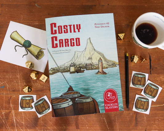 The physical version of the Zineshot Costly Cargo lies on the table, surrounded by handouts, dice, and a cup of coffee.