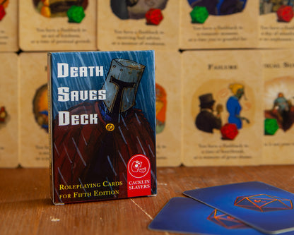 The packaging of the Death Saves Deck shows a sad knight. Rain pours down on his helmet. In the distance, you can see several of the 20 cards that come with this DnD accessory.